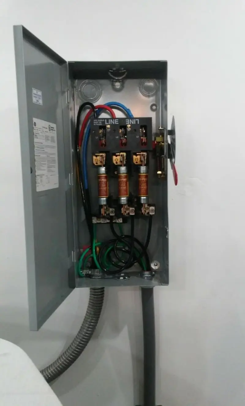 Three-phase disconnect switch installed for Smoke Detector Installation in Jan Phyl Village
